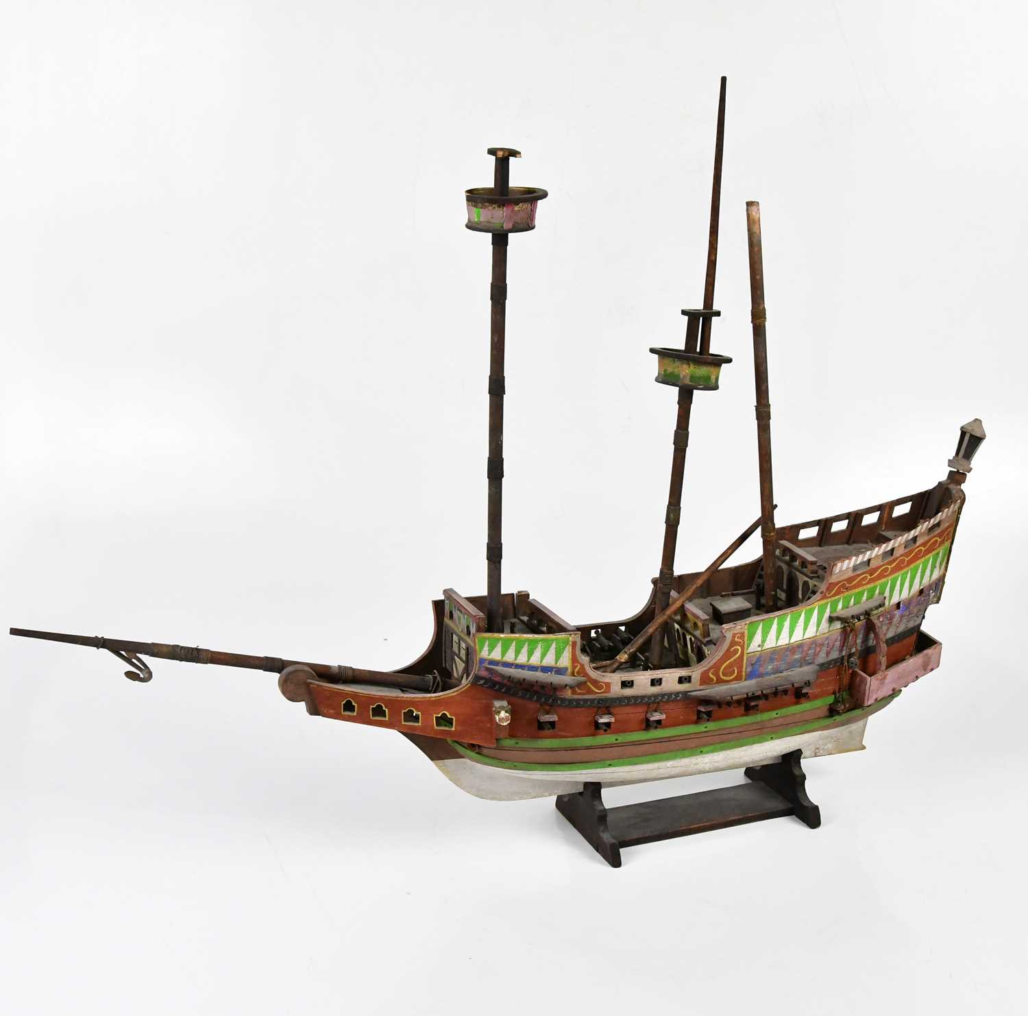 Lot 5041 - A painted wooden three masted ship on base,