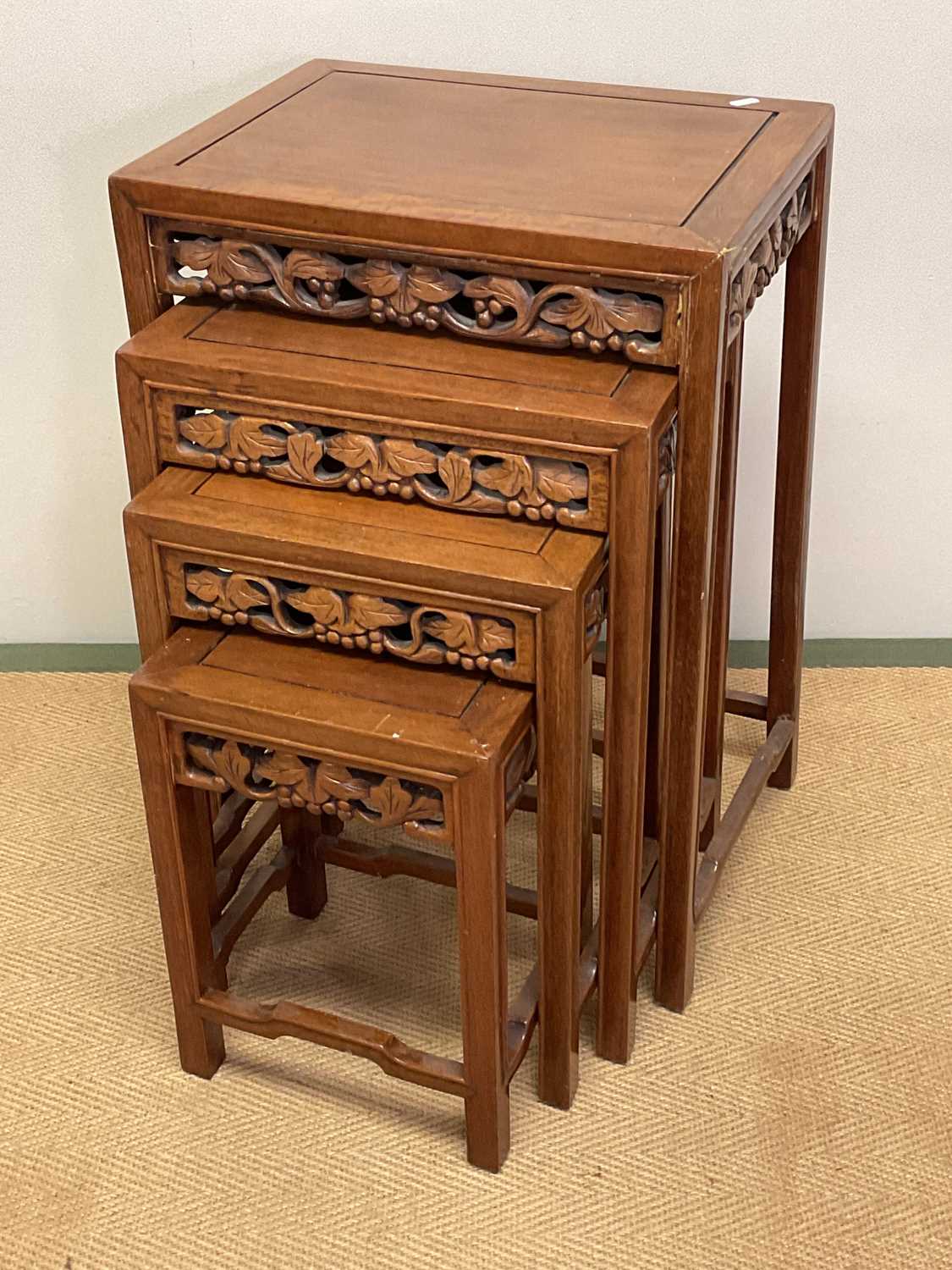Lot 777 - A nest of four Chinese tables with carved