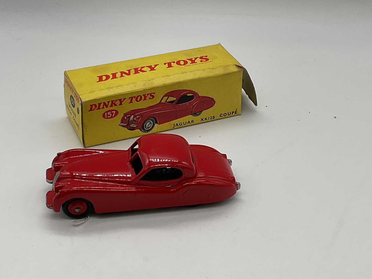 Lot 75 - DINKY; a boxed Jaguar 157, red.