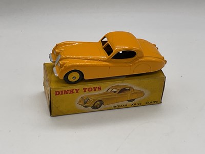 Lot 76 - DINKY; a boxed Jaguar XK120, 157, yellow.