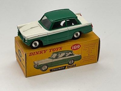 Lot 98 - DINKY; a boxed Triumph Herald, green/cream, 189.