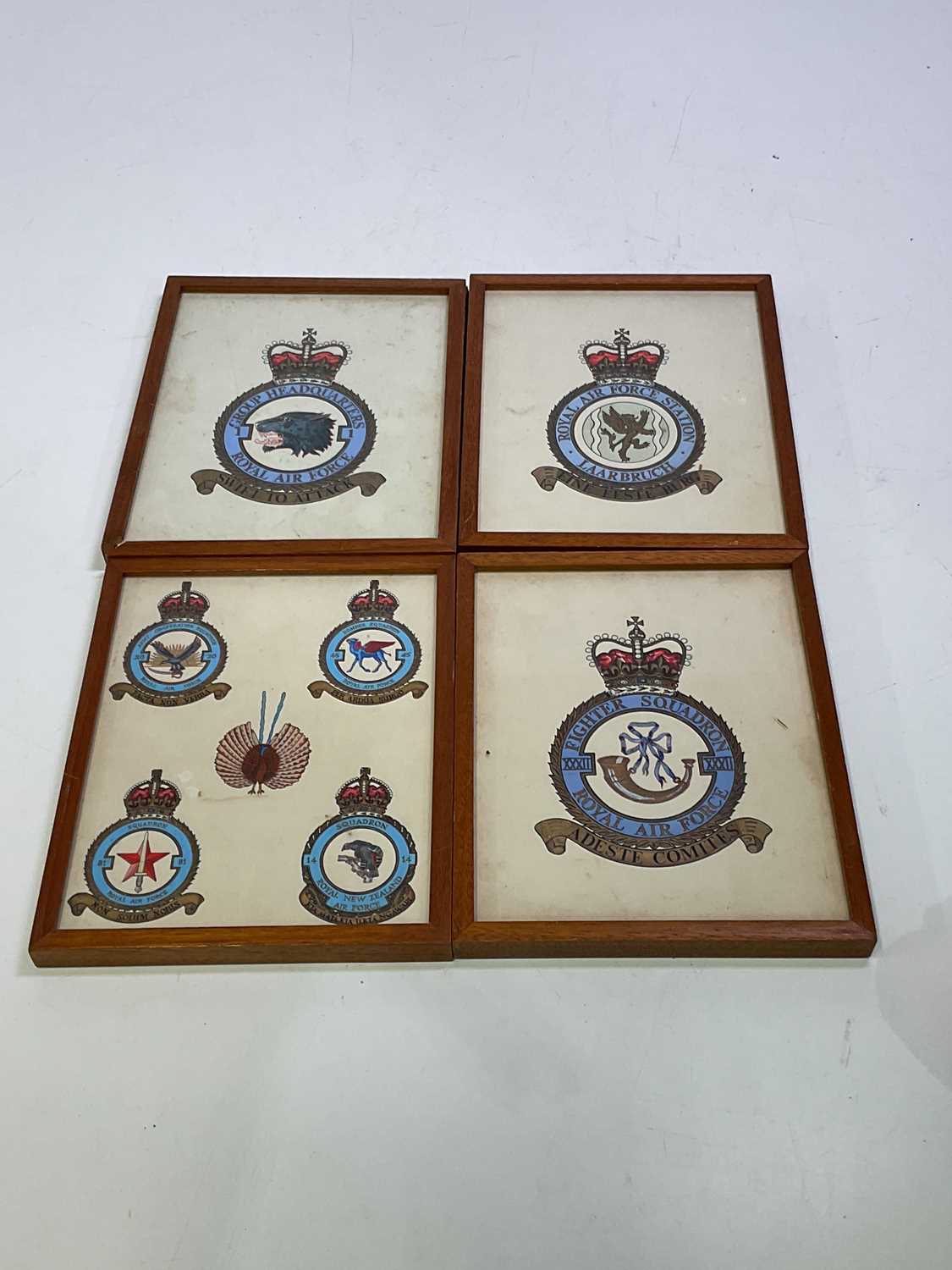 Lot 217 - Four paintings of Air Force squadron badges,...