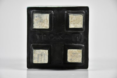 Lot 42 - TROIKA; an early four footed cube, each side...