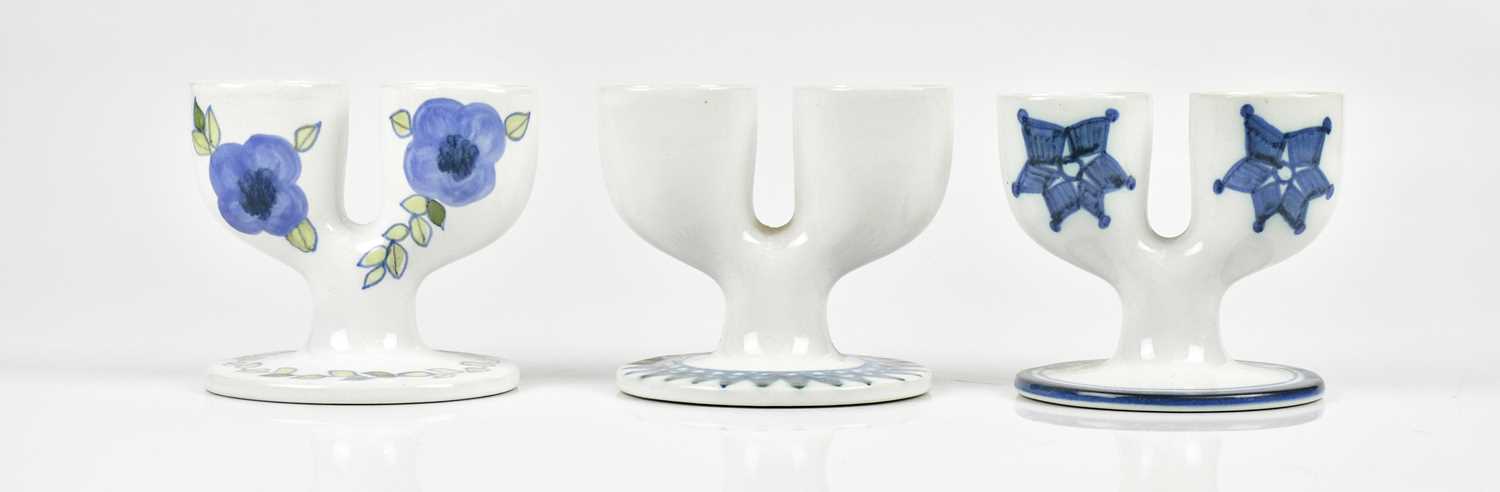 Lot 32 - TROIKA POTTERY; three double egg cups, to...