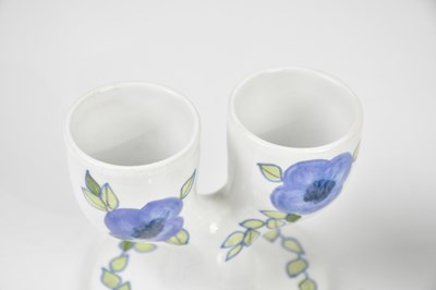 Lot 32 - TROIKA POTTERY; three double egg cups, to...