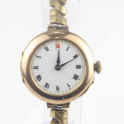 Lot 1072 - A ladies' 9ct gold wristwatch, the white...