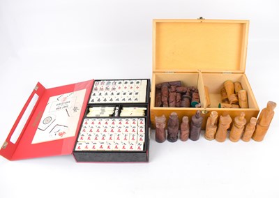 Lot 214 - A cased carved wooden chess set, and a cased...