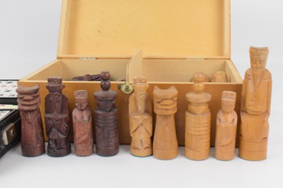 Lot 214 - A cased carved wooden chess set, and a cased...