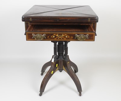 Lot 67 - A Victorian rosewood envelope table with small...
