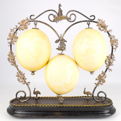 Lot 197 - A 19th century group of three ostrich eggs,...