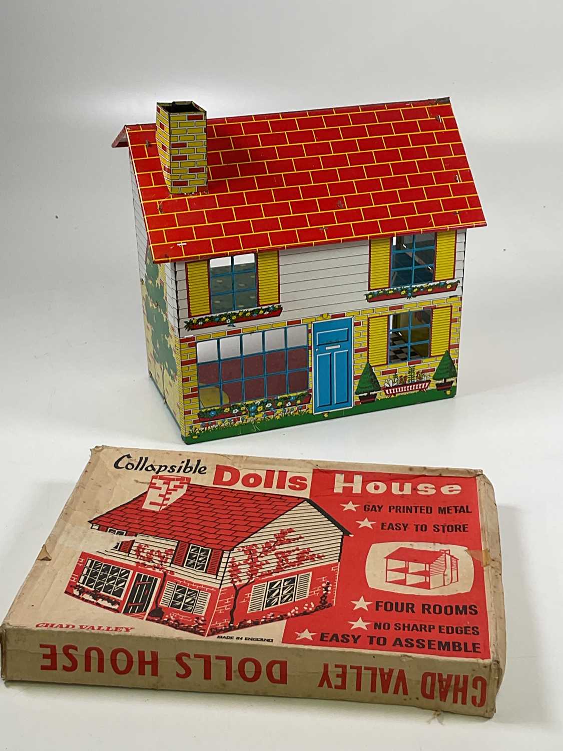 Lot 115 - CHAD VALLEY; a collapsible 1960s tin doll's...