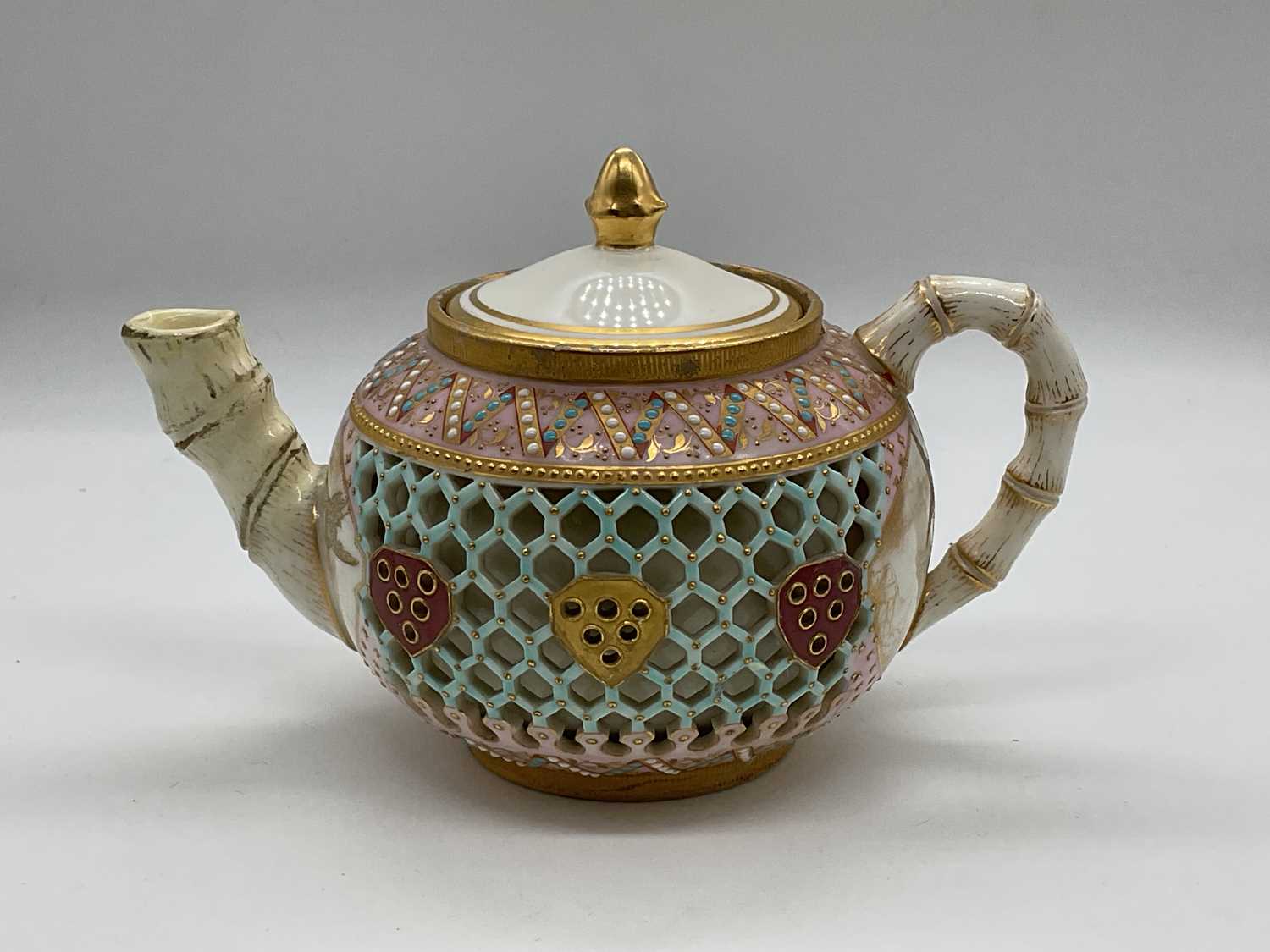 Lot 411 - ROYAL WORCESTER; a double walled reticulated