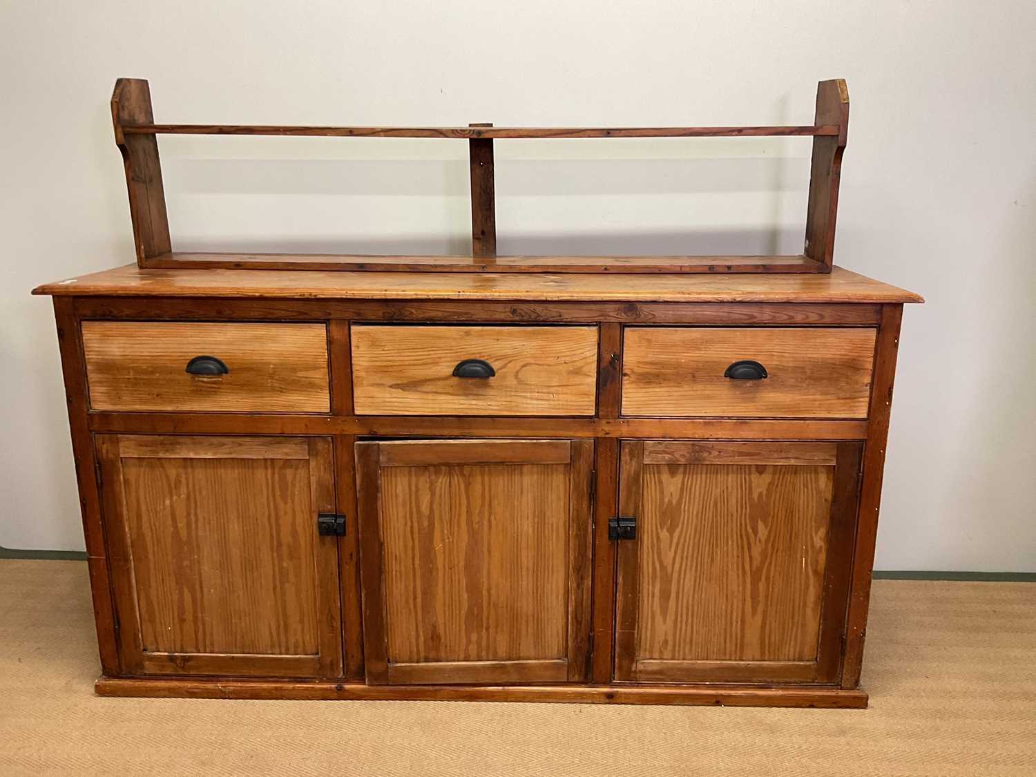 Lot 684 A pitch pine kitchen dresser base with three