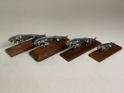 Lot 19 - Four chrome Jaguar car mascots mounted on...