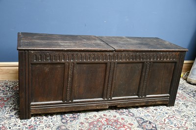 Lot 2430 - An 18th century carved oak four panel coffer,...