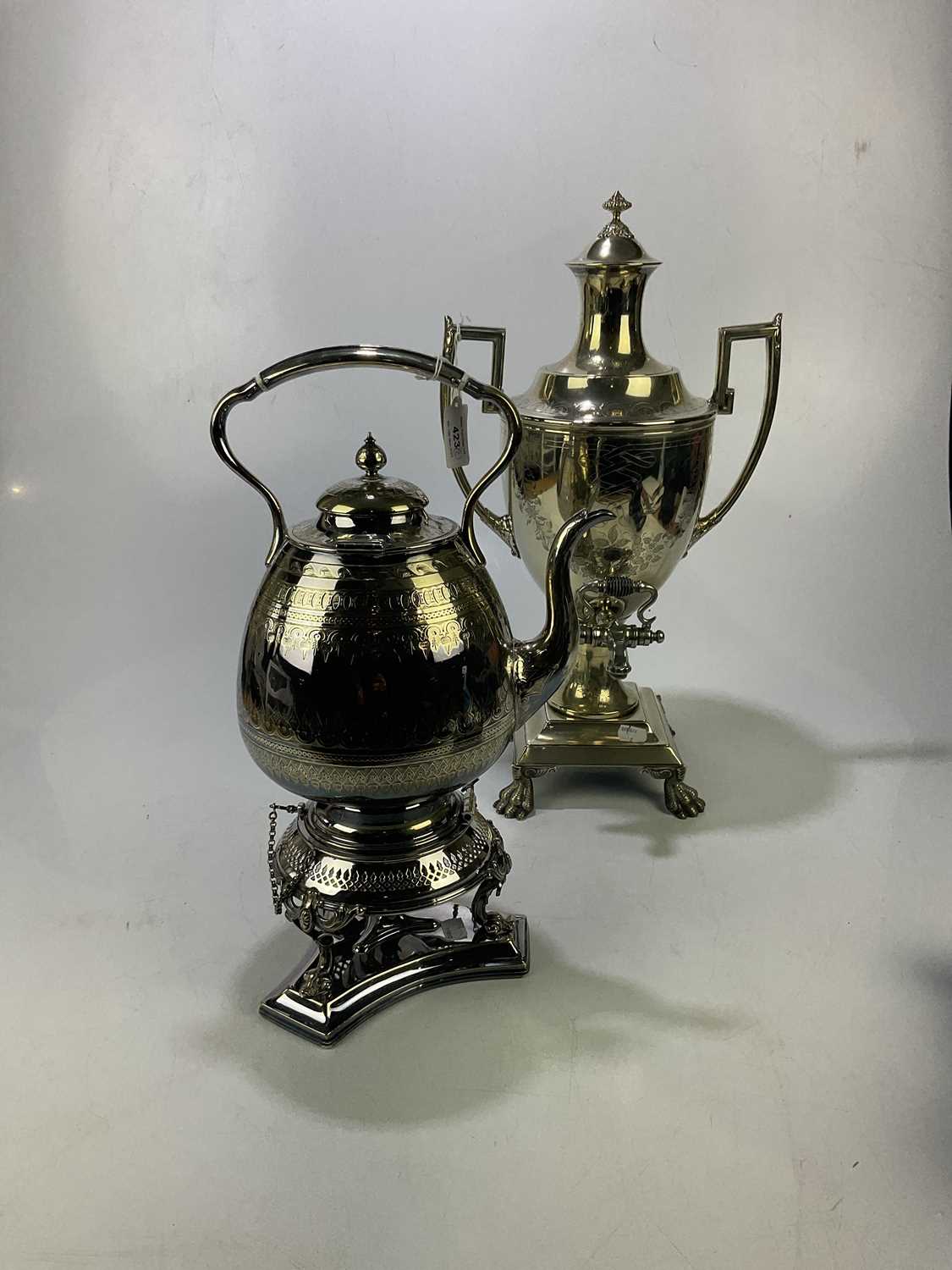 Lot 423 - A silver plated tea urn on claw feet, height...