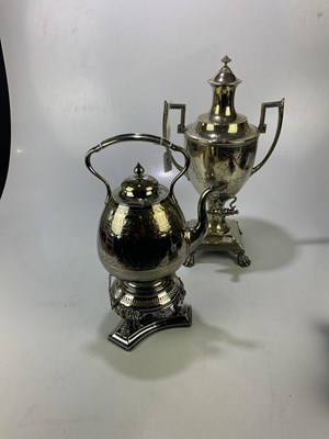 Lot 423 - A silver plated tea urn on claw feet, height...