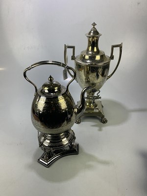 Lot 423 - A silver plated tea urn on claw feet, height...