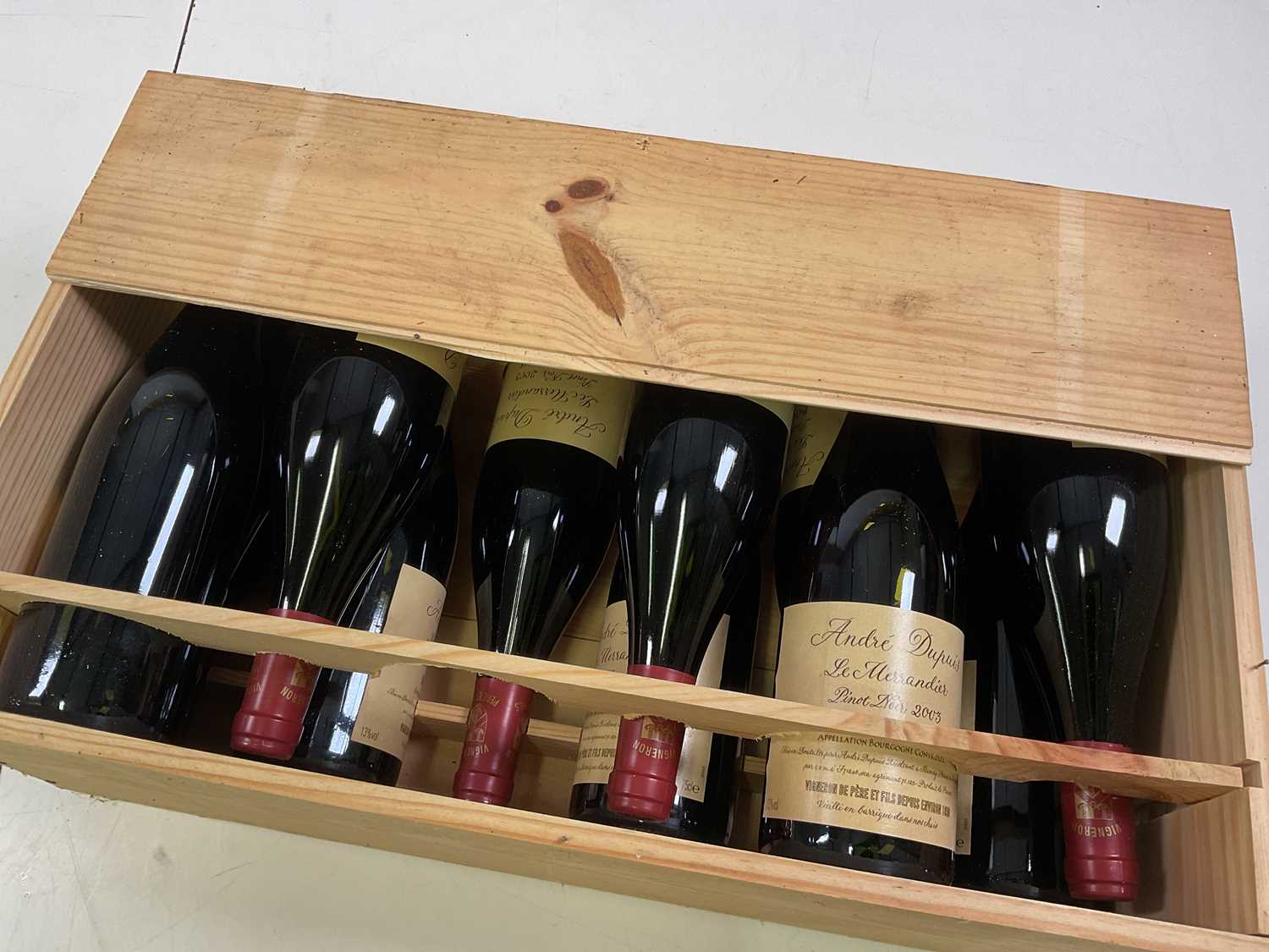 Lot 254 - A wooden crate containing eleven bottles of...