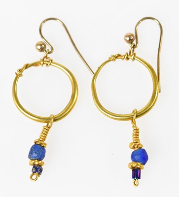 Lot 675 - A pair of yellow metal earrings based on the...