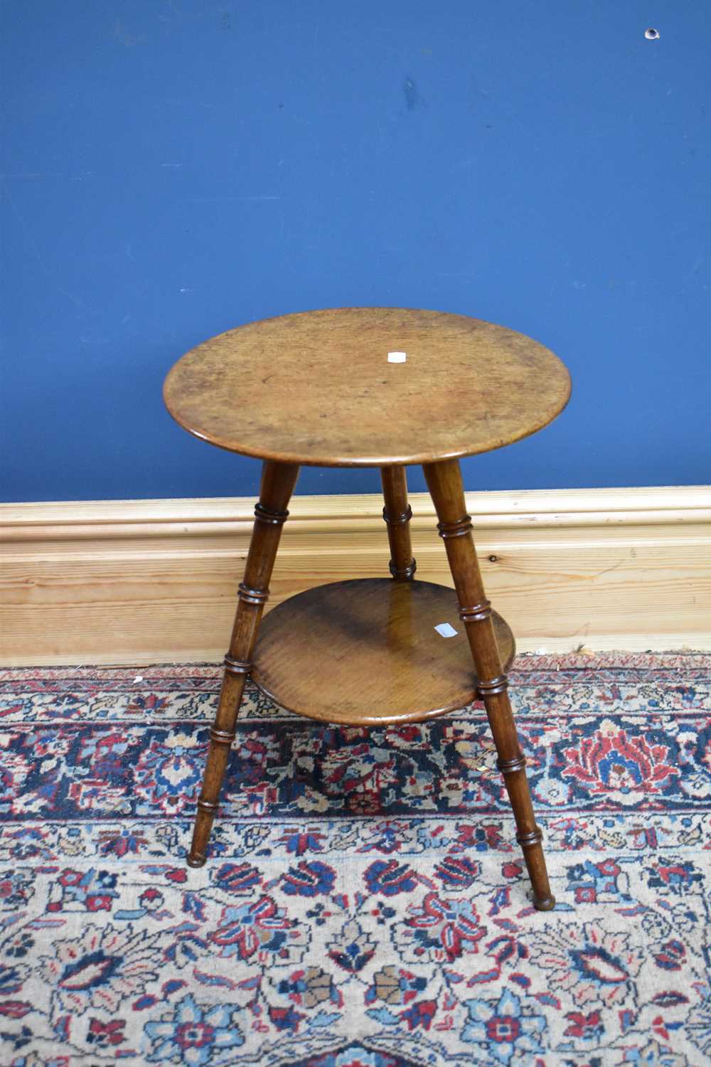 Lot 2397 - A circular oak two tier occasional table,...