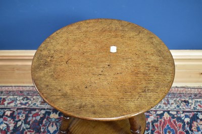 Lot 2397 - A circular oak two tier occasional table,...