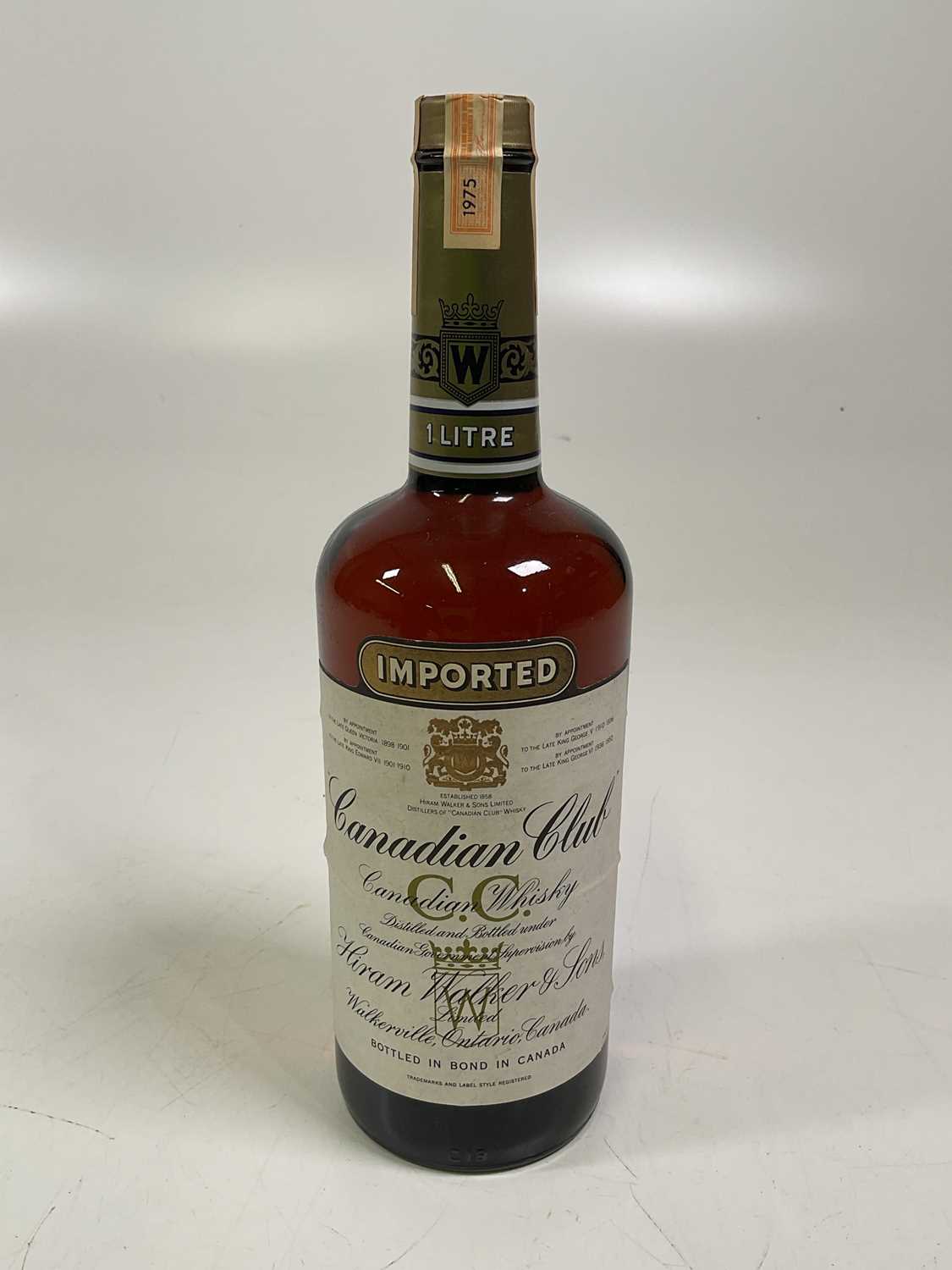 Lot 276 - A litre bottle of Canadian Club Whisky.