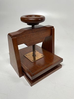 Lot 41 - A vintage mahogany press with brass inserts,...