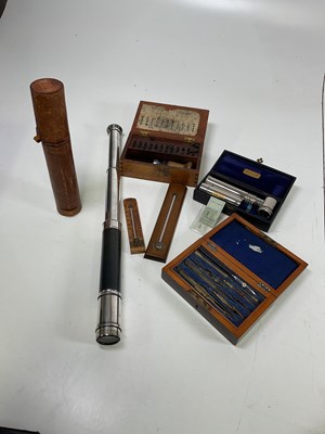 Lot 11 - A leather cased two draw telescope, a...