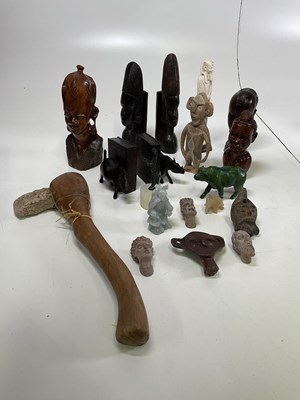 Lot 24 - A collection of carved African wooden figures,...