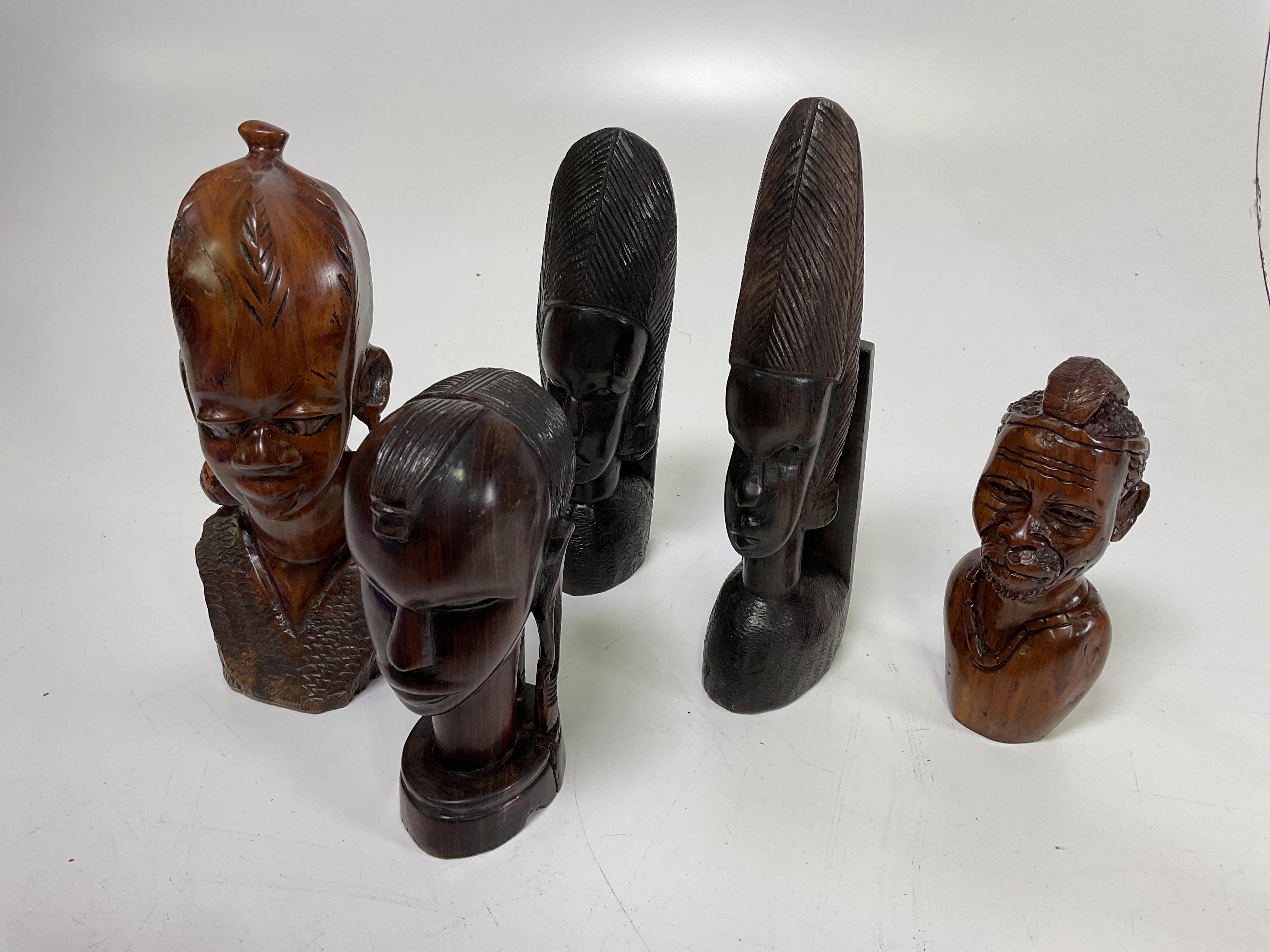 Lot 24 A collection of carved African wooden figures,