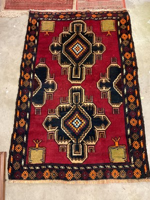 Lot 831 - A vintage Afghan woollen rug, with two others,...