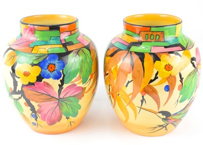 Lot 300 - A pair of Art Deco decorated baluster vases...