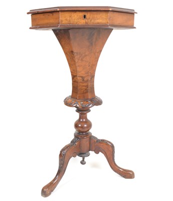 Lot 62 - A Victorian walnut sewing table, the hinged...