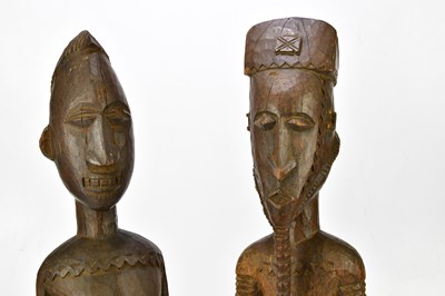 Lot 1223 - Two hardwood carved African figures of male...