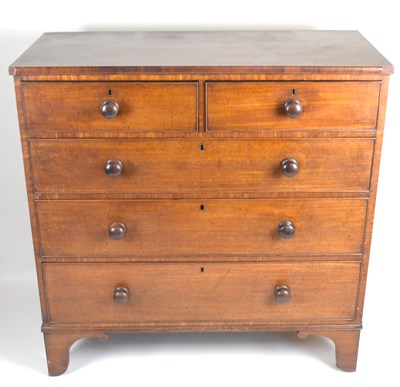 Lot 3 - An early 19th century mahogany chest of two...