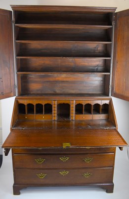 Lot 32 - A George III oak bureau bookcase, the two-door...