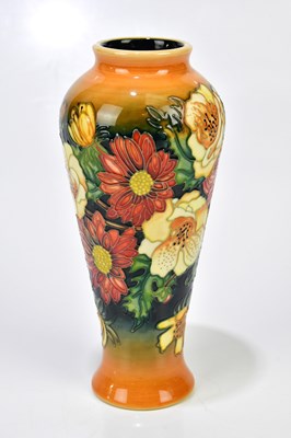 Lot 135 - MOORCROFT; a vase of tapering cylindrical form,...