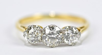 Lot 60 - A yellow metal diamond three stone dress ring,...