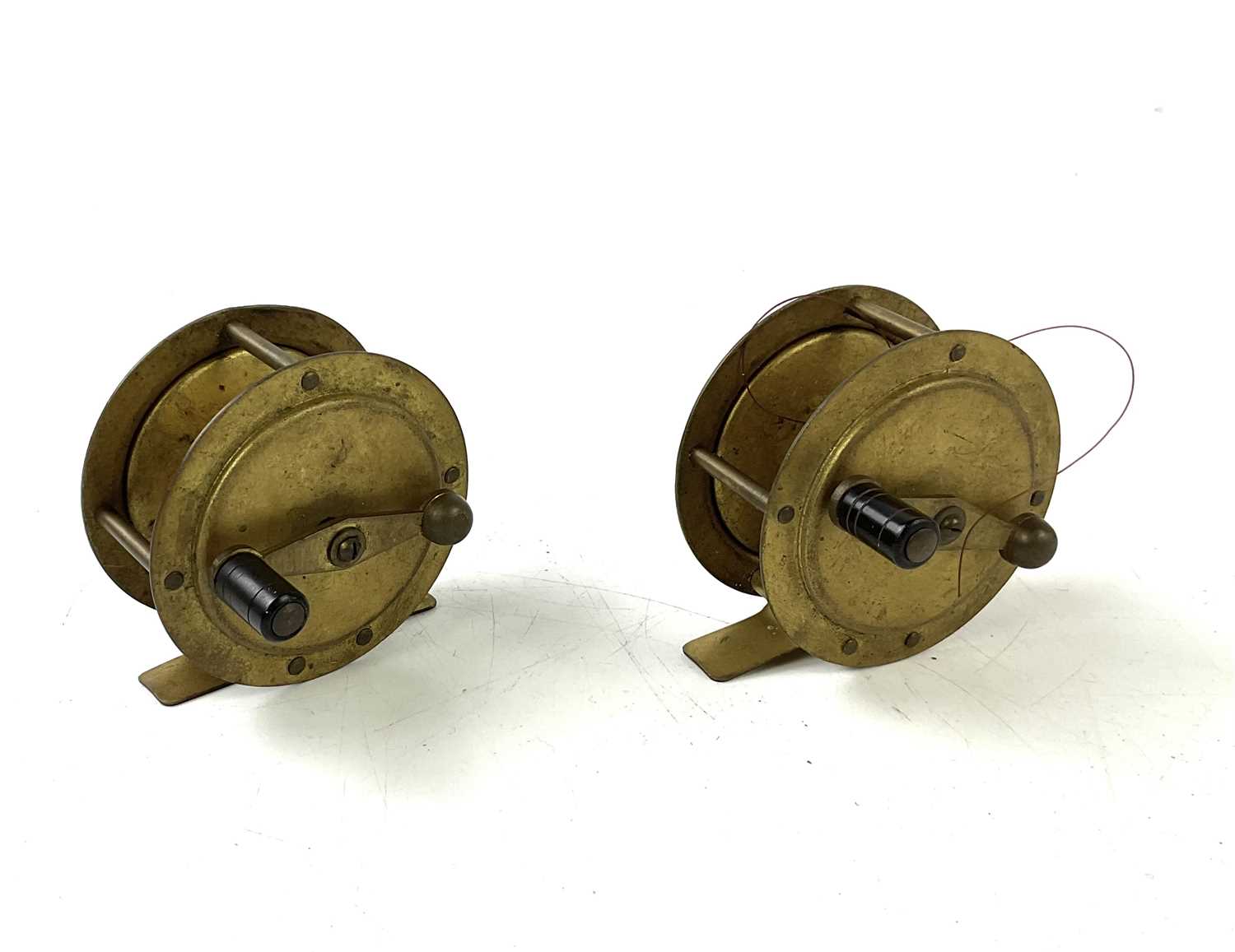 Lot 5292 - MILBRO; two vintage brass fishing reels.