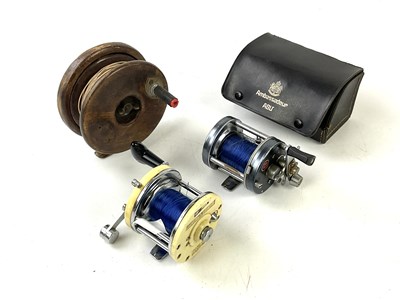 Lot 5287 - A group of three fishing reels to include a...