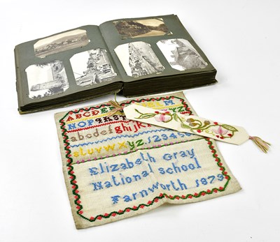 Lot 495 - An early 20th century postcard album...