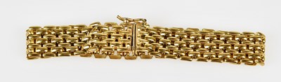 Lot 532 - A yellow metal flat link bracelet, length 19cm,...