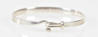 Lot 546 - GEORG JENSEN; a 'Torun' sterling silver bangle,...