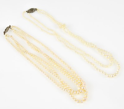 Lot 430 - A graduated three strand cultured pearl...