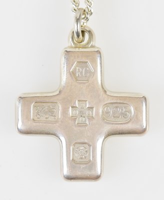 Lot 761 - A silver cross pendant suspended on silver...