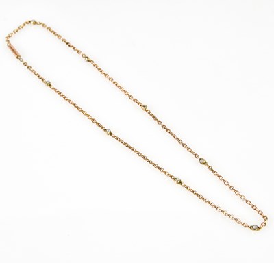 Lot 419 - A 9ct rose gold and seed pearl set chain,...