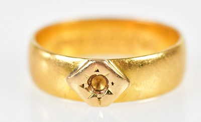 Lot 172 - A 22ct yellow gold wedding band with recess...