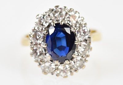 Lot 99 - An 18ct yellow gold sapphire and diamond oval...