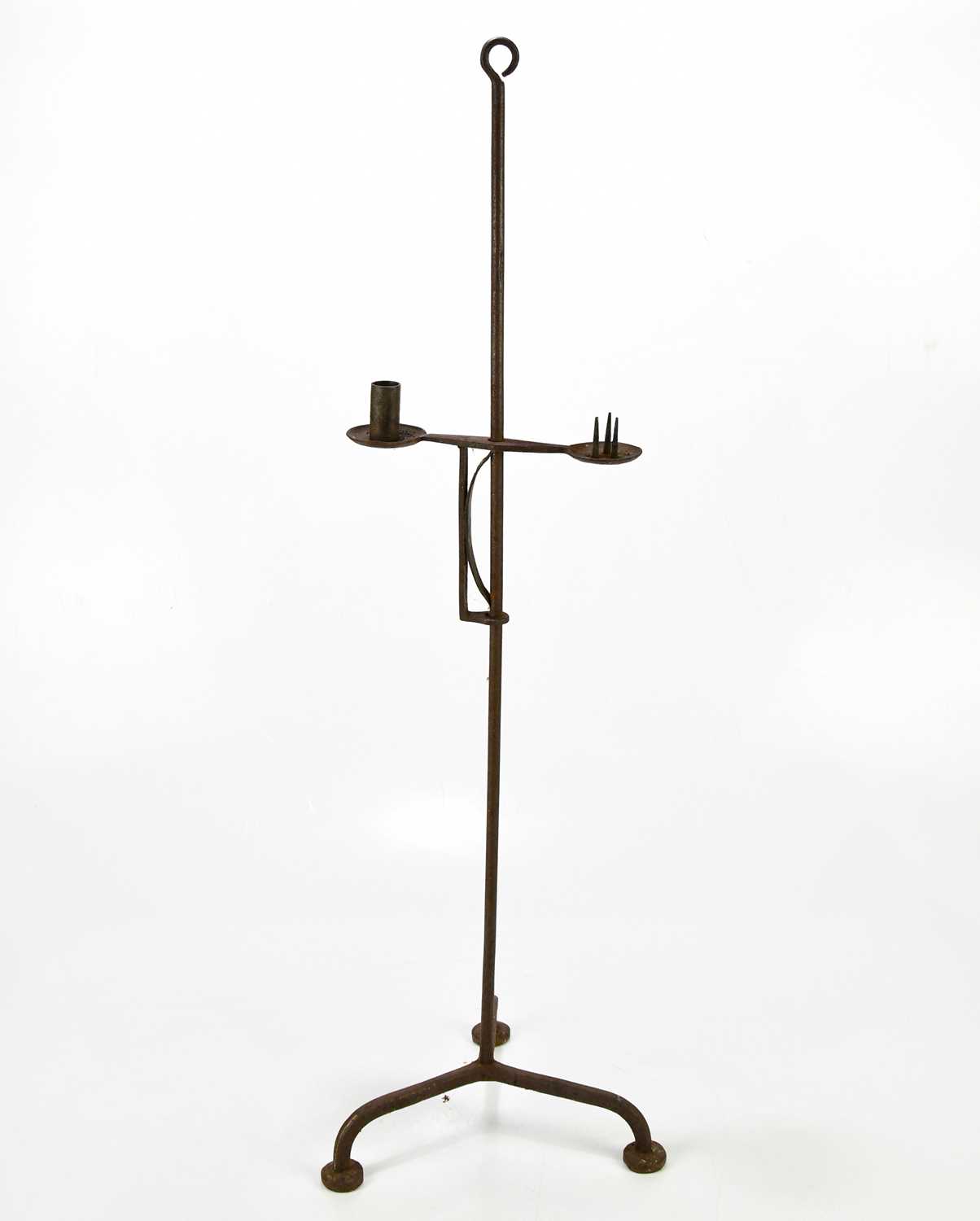 Lot 1621 - A cast iron free standing candle holder,...